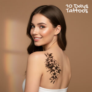 Tatouage temporaire lys fleurs noires vertical épaule dos femme 10 Days Tattoos